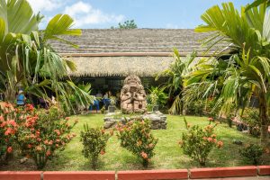 Tiki statue and garden. Marquesas Islands, French Polinesia 