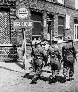 Allies, paranoid of disguised paratroopers, have threatened to shoot any German prisoners who are not in uniform. Berlin responds: "We'll shoot 10 French prisoners for every 1 you kill."