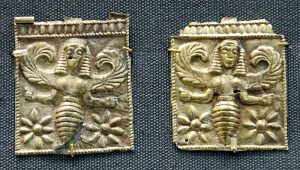 Bee-goddess, perhaps associated with Artemis above female heads. Gold plaques, 7th century BC.