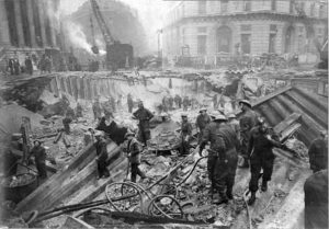 A huge bomb has hit Bank tube station, in central London, blasting a vast crater where hundreds of Londoners were sheltering underground.The German bomb fell in Bank station's ticket hall, & the explosion swept down escalators & tunnels packed with civilians. 111 casualties, at least 50 dead.