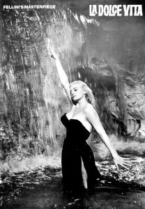 Anita Ekberg La Dolce Vita fountain scene movie poster. The Trevi featured in the 1960 classic film "La Dolce Vita" in which screen diva Anita Ekberg went for a dip in the fountain wearing a skimpy black dress