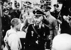 Heinrich Himmler, Head of the SS, is touring Nazi concentration camp of Dachau, alongside Dutch fascist leader Anton Mussert.