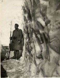 Greek soldier in Albanian mountains. Another Italian counterattack in Albanian mountains is bloodily repulsed in bitter weather conditions- snow so deep, Greeks are digging trenches in it