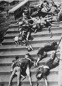 Japanese bombers smashed Chongqing for hours today, collapsing tunnel shelters; 4000 people have suffocated, trapped under tons of sandstone.