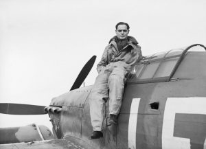Legless, famous Royal Air Force fighter pilot Douglas Bader has been shot down by the Germans over France. He parachuted to safety- leaving his prosthetic legs trapped in the burning plane.