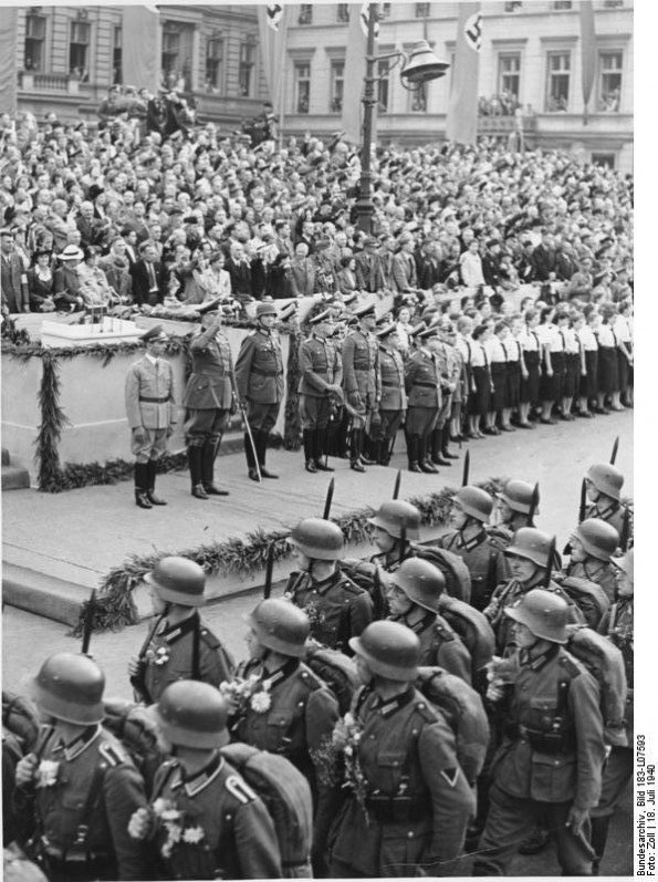 Germans celebrate their victorious soldiers with huge military parades- & hear Goebbels promise that after one more battle, they will enjoy peace.