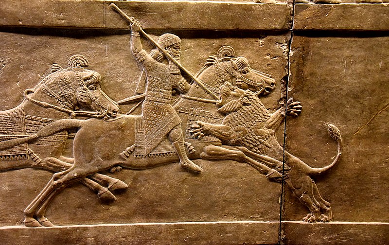 Assyrian king Ashurbanipal on his horse thrusting a spear onto a lion’s head. Alabaster bas-relief from Nineveh, dating back to 645-635 BCE and is currently housed in the British Museum, London