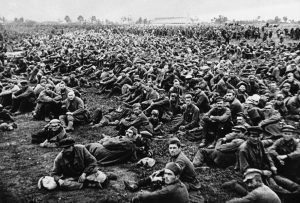 Evidence of the fierce fighting on the Moscow sector of the front is provided in this photo showing what the Germans claim to be some of the 650,000 Russian prisoners which they captured at Bryansk and Vyasma. They are here seen waiting to be transported to a prisoner of war camp somewhere in Russia, on November 2, 1941.