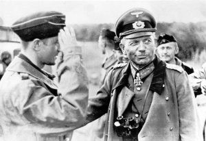 General Heinz Guderian, commander of Germany’s Panzergruppe 2, chats with members of a tank crew on the Russian front, on September 3, 1941.
