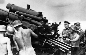German Army Commander Colonel General Ernst Busch inspects an anti-aircraft gun position, somewhere in Germany, on Sept. 3, 1941.