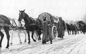 German infantrymen in heavy winter gear march next to horse-drawn vehicles as they pass through a district near Moscow, in November 1941. Winter conditions strained an already thin supply line, and forced Germany to halt its advance – leaving soldiers exposed to the elements and Soviet counterattacks, resulting in heavy casualties and a serious loss of momentum in the war.