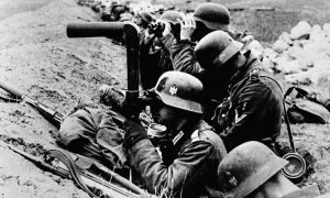 German infantrymen watch enemy movements from their trenches shortly before an advance inside Soviet territory, on July 10, 1941.