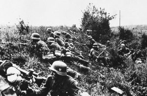 Nazi troops lie concealed in the undergrowth during the fighting prior to the capture of Kiev, Ukraine, in 1941.